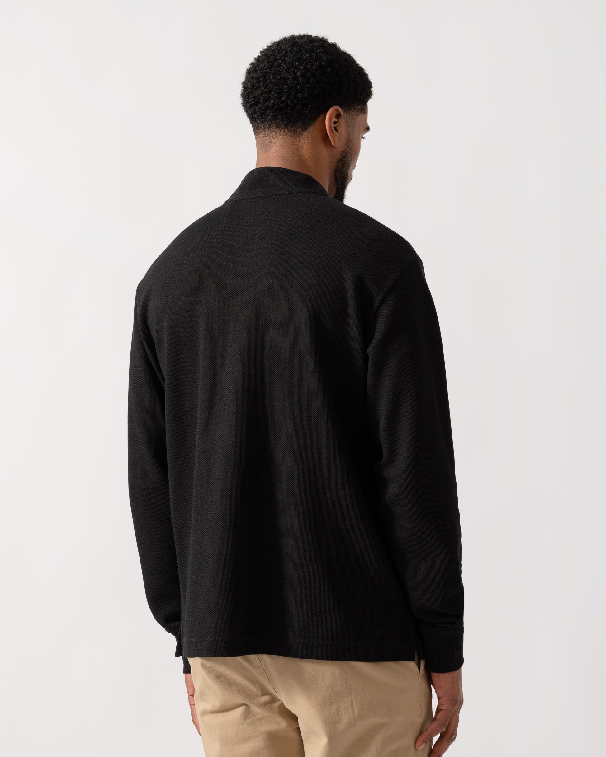 Model wearing BOSS Orange Hive Mens 1/4 Zip Sweatshirt in Black 001 - back