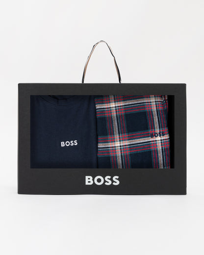 BOSS branded box with navy shirt and plaid pants on a white background