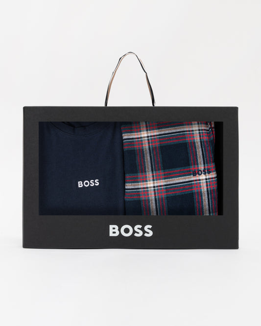 BOSS branded box with navy shirt and plaid pants on a white background