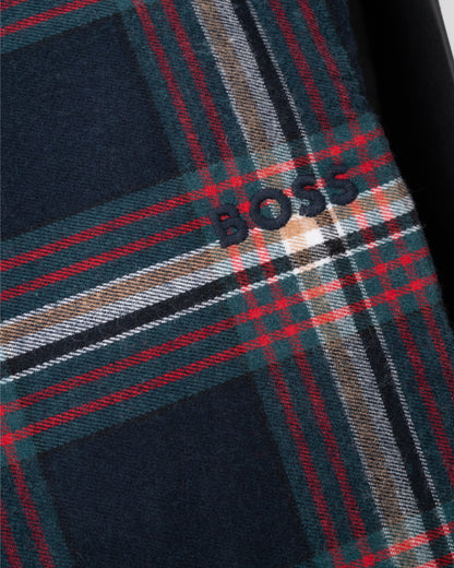 Close-up of a plaid fabric with 'BOSS' branding.