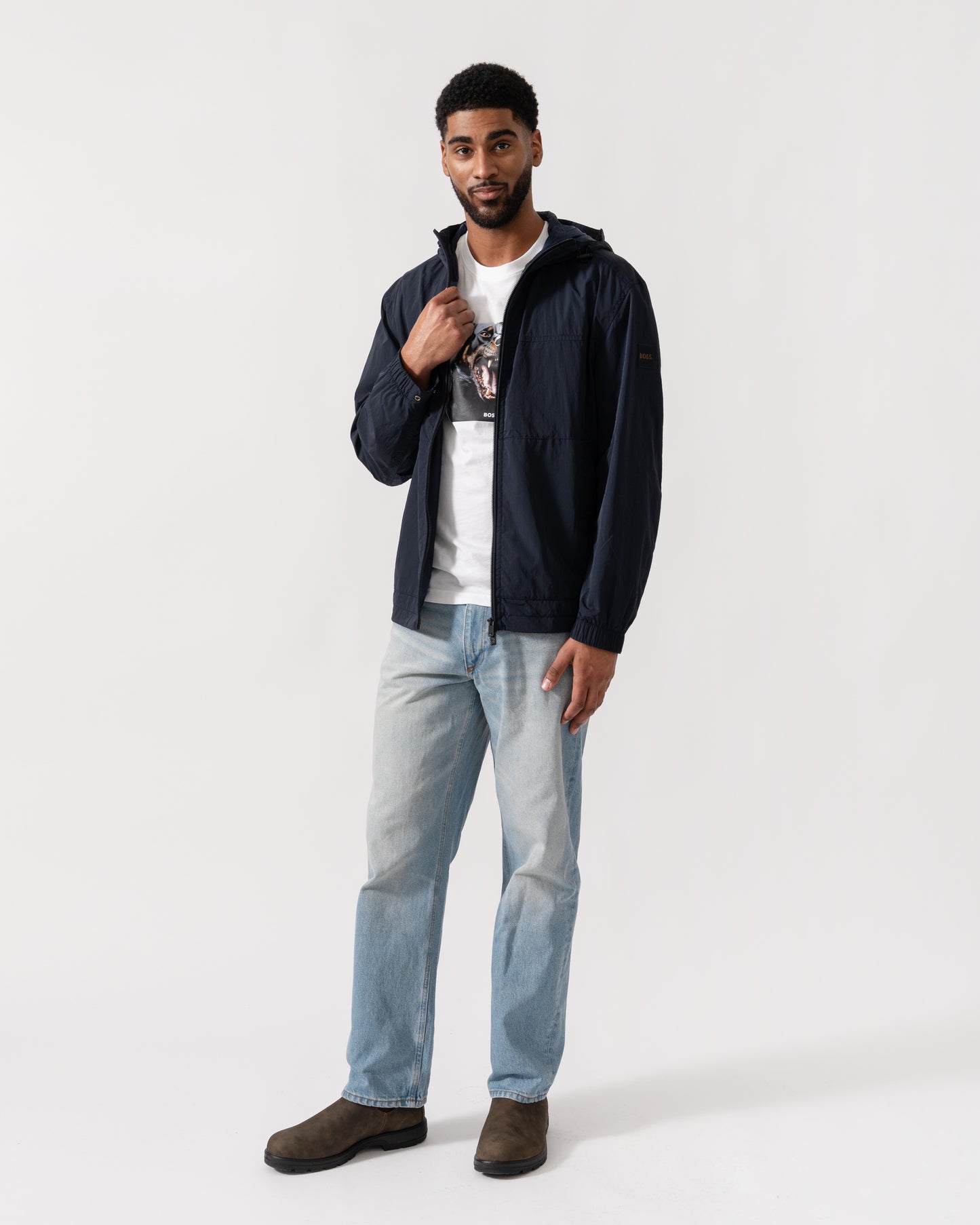 Model wearing BOSS Orange Orip Hooded Jacket in Dark Blue 404 - Full Length