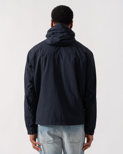 Model wearing BOSS Orange Orip Hooded Jacket in Dark Blue 404 - back