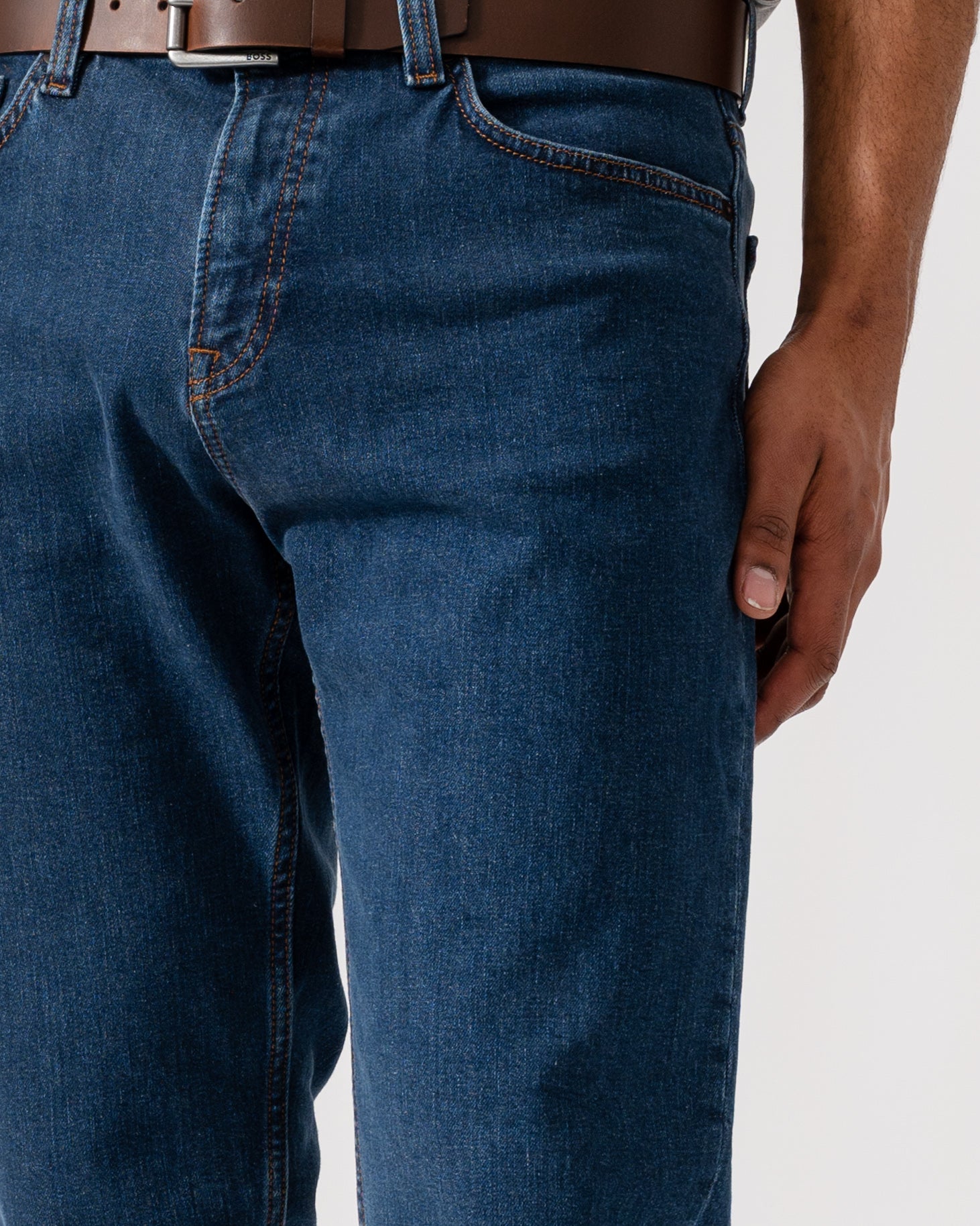 Model wearing BOSS Orange Mens ReMaine Jeans in Dark Blue 409 - Detail