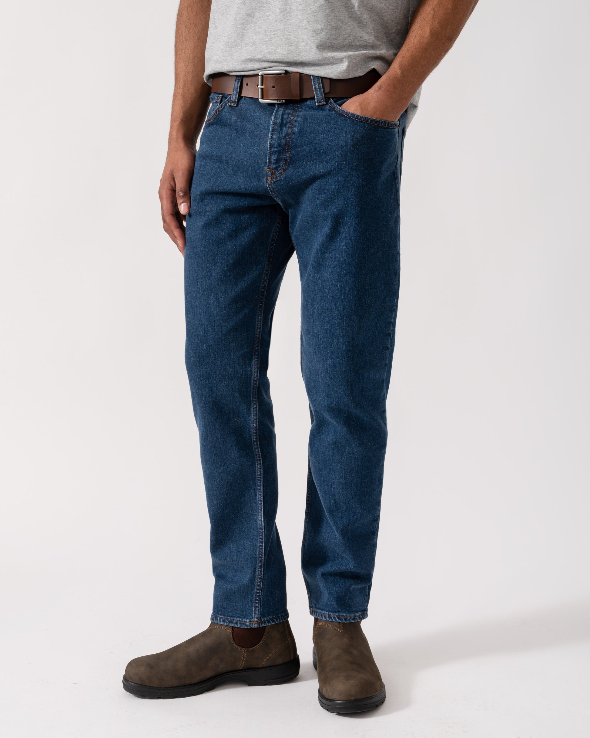 Model wearing BOSS Orange Mens ReMaine Jeans in Dark Blue 409 - Main
