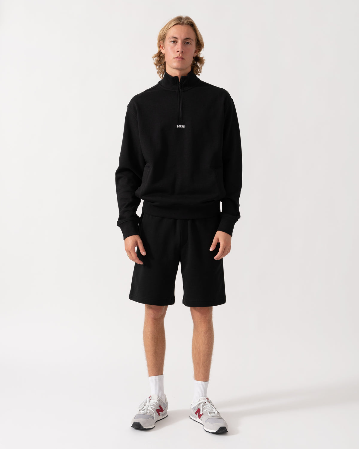 Model wearing the BOSS Orange Smallzip Mens 1/4 Zip Sweatshirt - Black 001