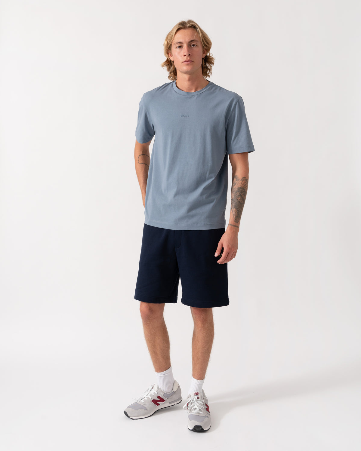 Model wearing the Lacoste Regular Fit Mens Fleece Shorts - Blue Marine 166