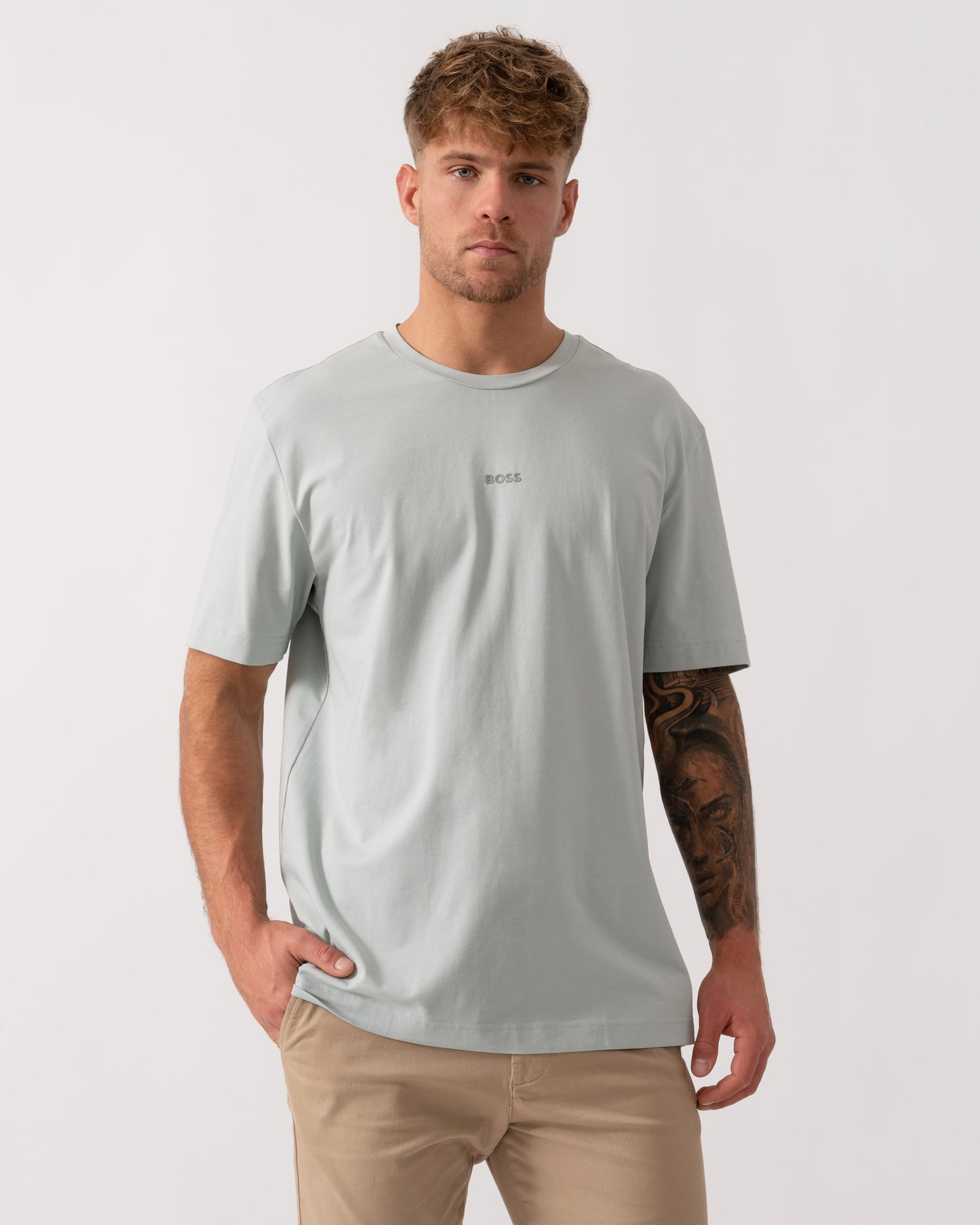 Model wearing BOSS Orange TChup Mens Crew Neck Small Logo T-Shirt in Silver 043 - Main