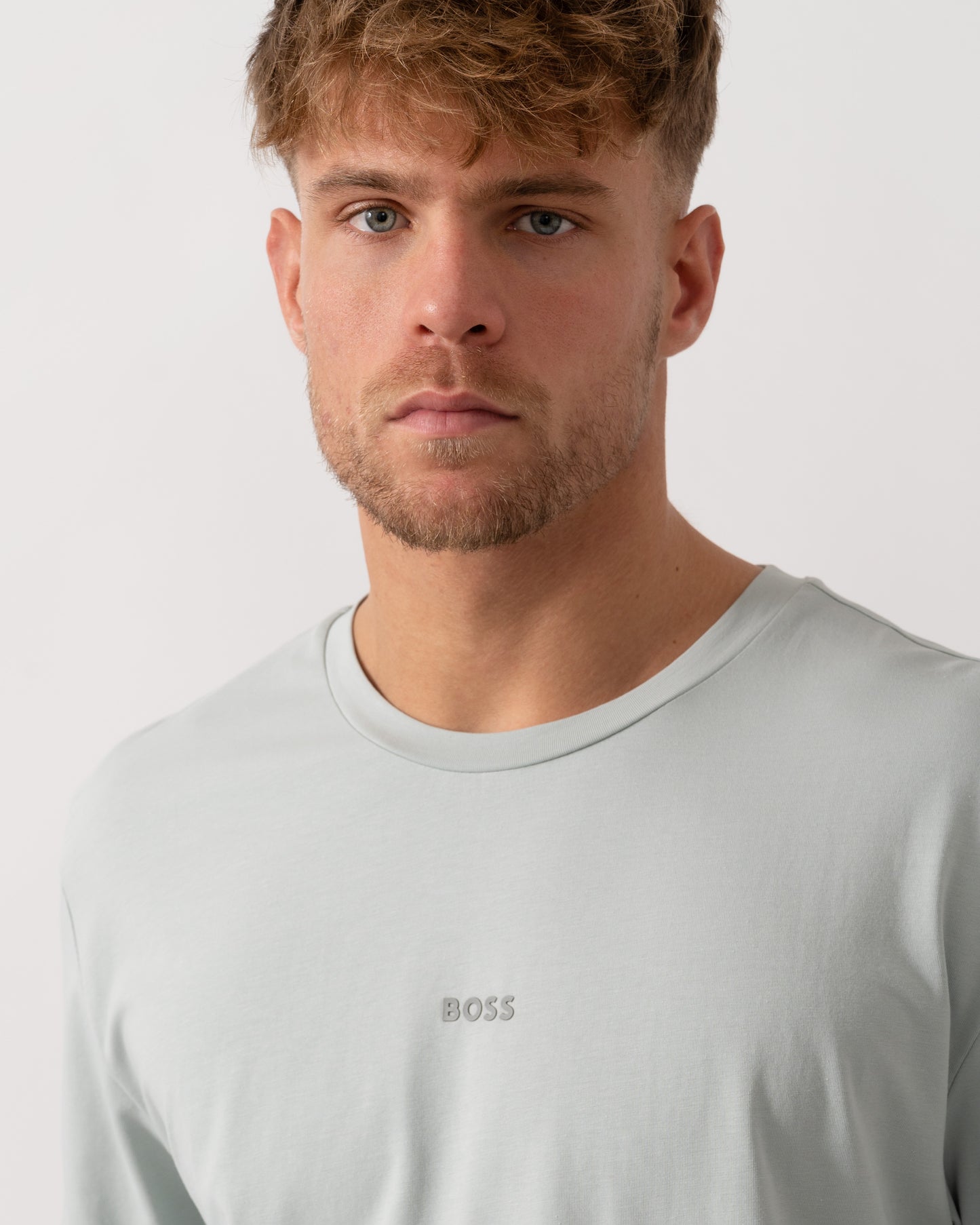 Model wearing BOSS Orange TChup Mens Crew Neck Small Logo T-Shirt in Silver 043 - Detail