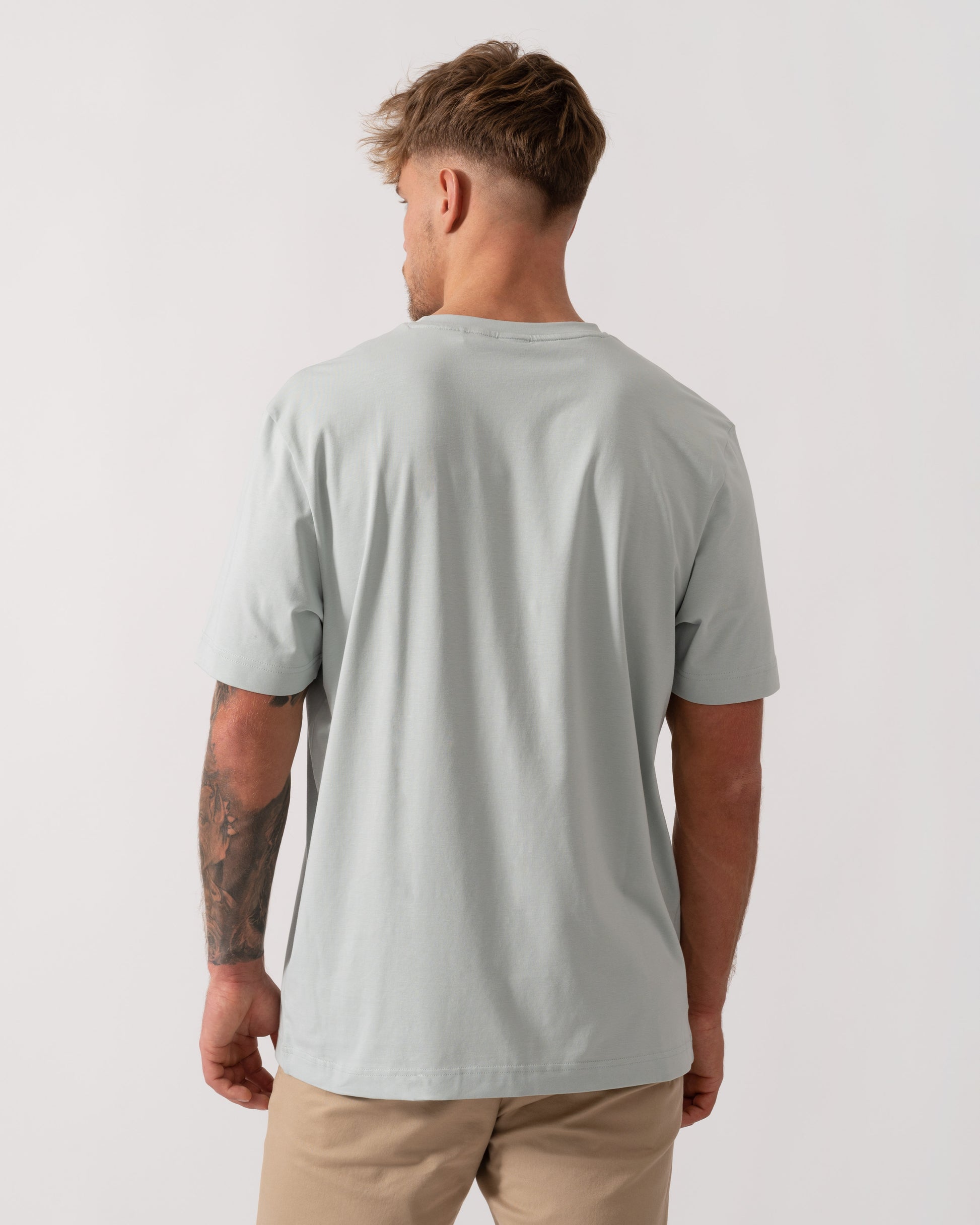 Model wearing BOSS Orange TChup Mens Crew Neck Small Logo T-Shirt in Silver 043 - Back
