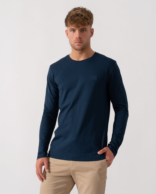 Model wearing BOSS Orange Tacks Mens Long Sleeve T-Shirt in Open Blue 464 - Main