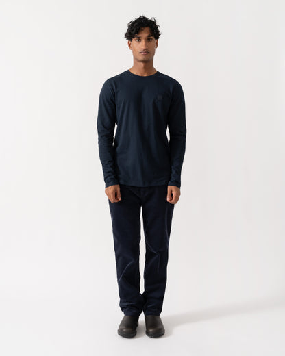 Man wearing BOSS Orange Tacks Mens Long Sleeve T-Shirt with logo Patch - Dark Blue 404