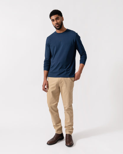 Model wearing BOSS Orange Tchark Long Sleeve Stretch Cotton T-Shirt in Open Blue 464 - full length