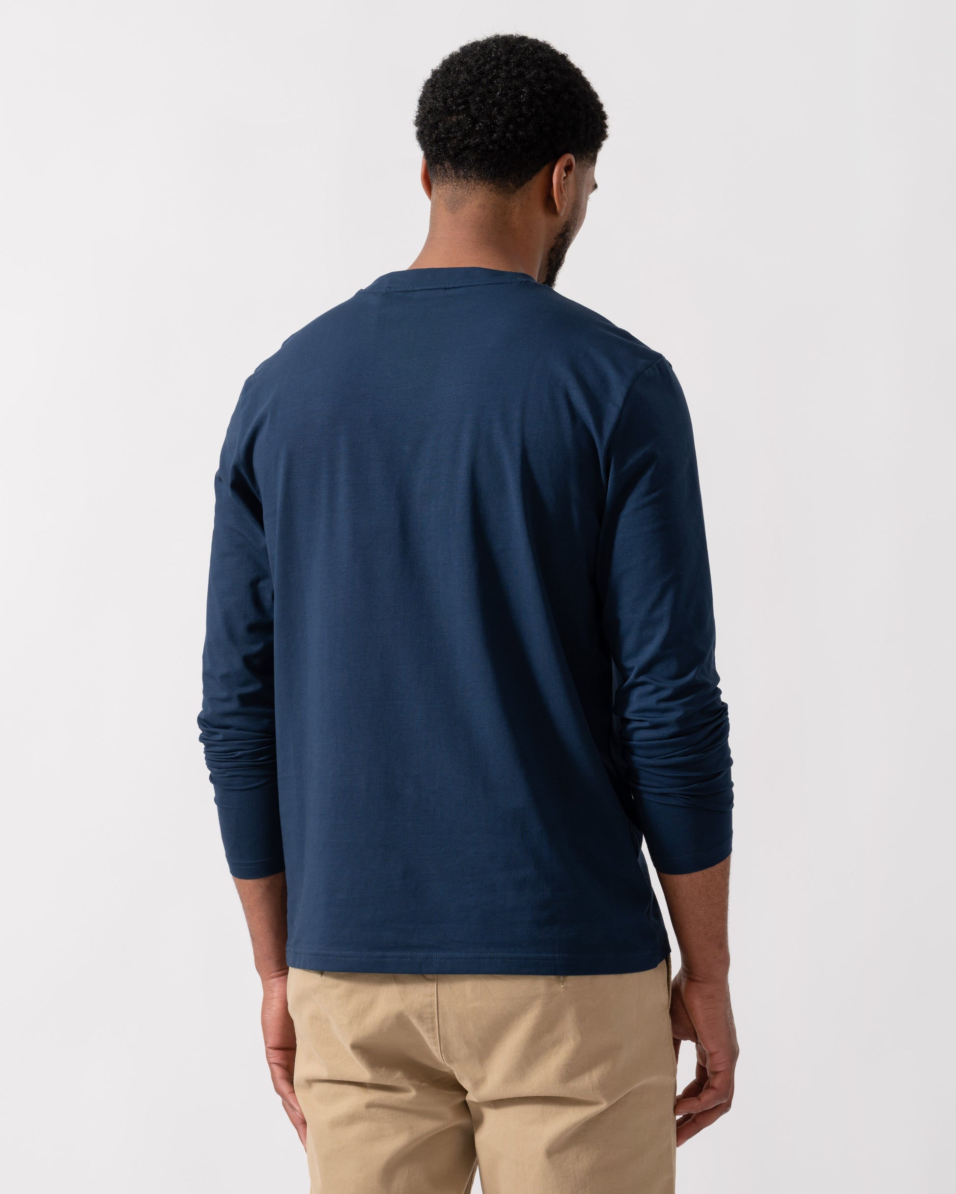 Model wearing BOSS Orange Tchark Long Sleeve Stretch Cotton T-Shirt in Open Blue 464 - back