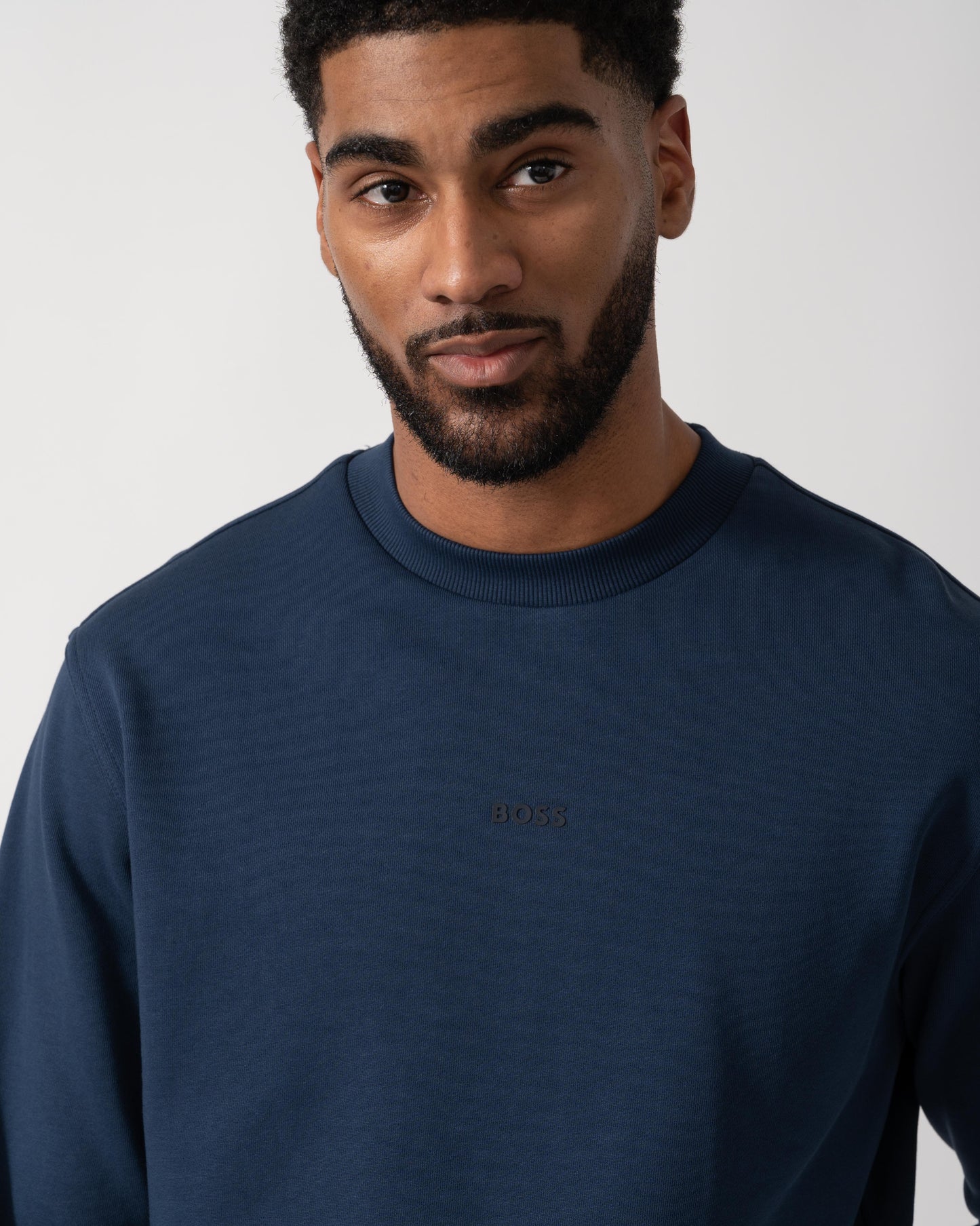 Model wearing BOSS Orange WeSmall Crew Sweatshirt in Open Blue 464 - detail