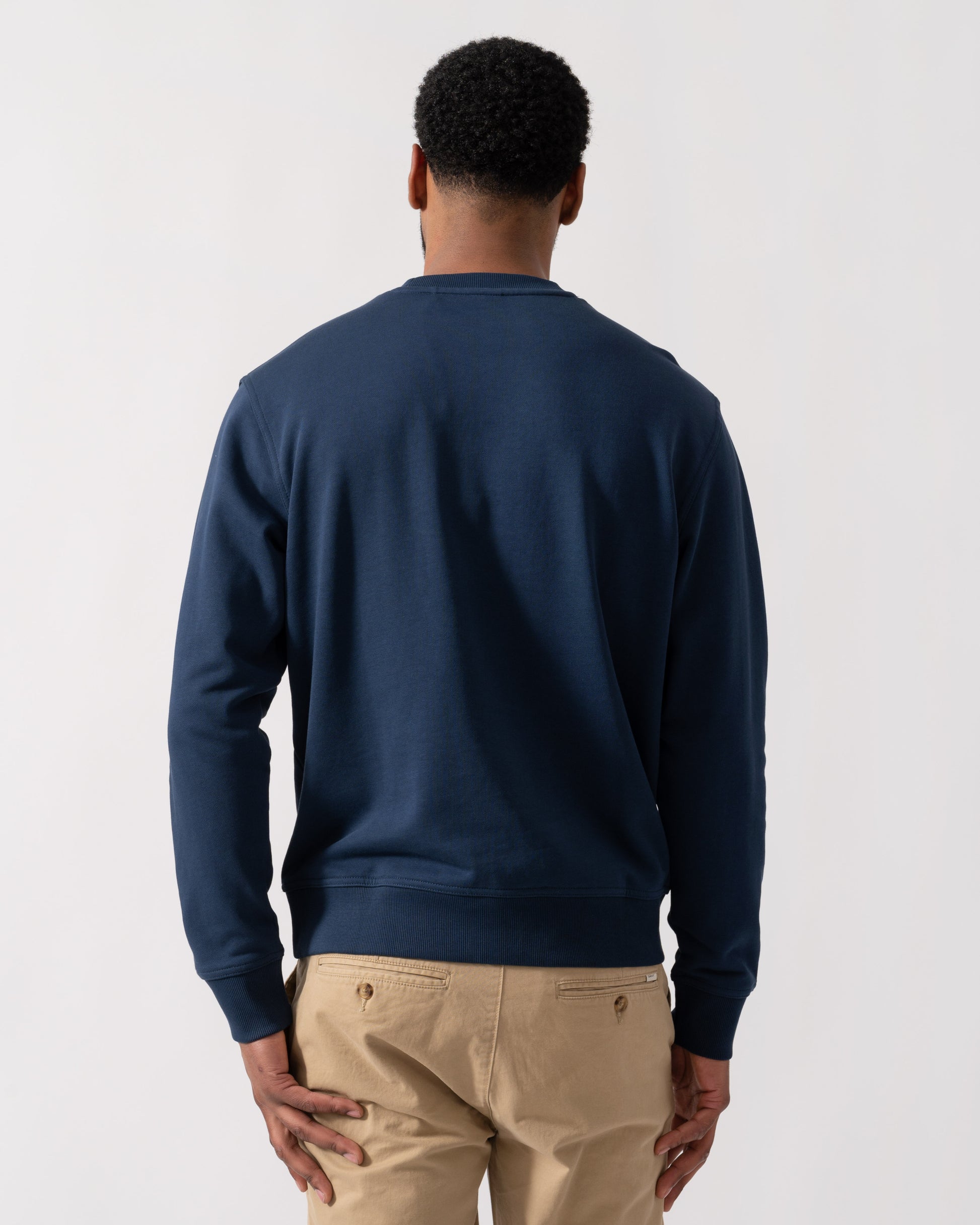 Model wearing BOSS Orange WeSmall Crew Sweatshirt in Open Blue 464 - back