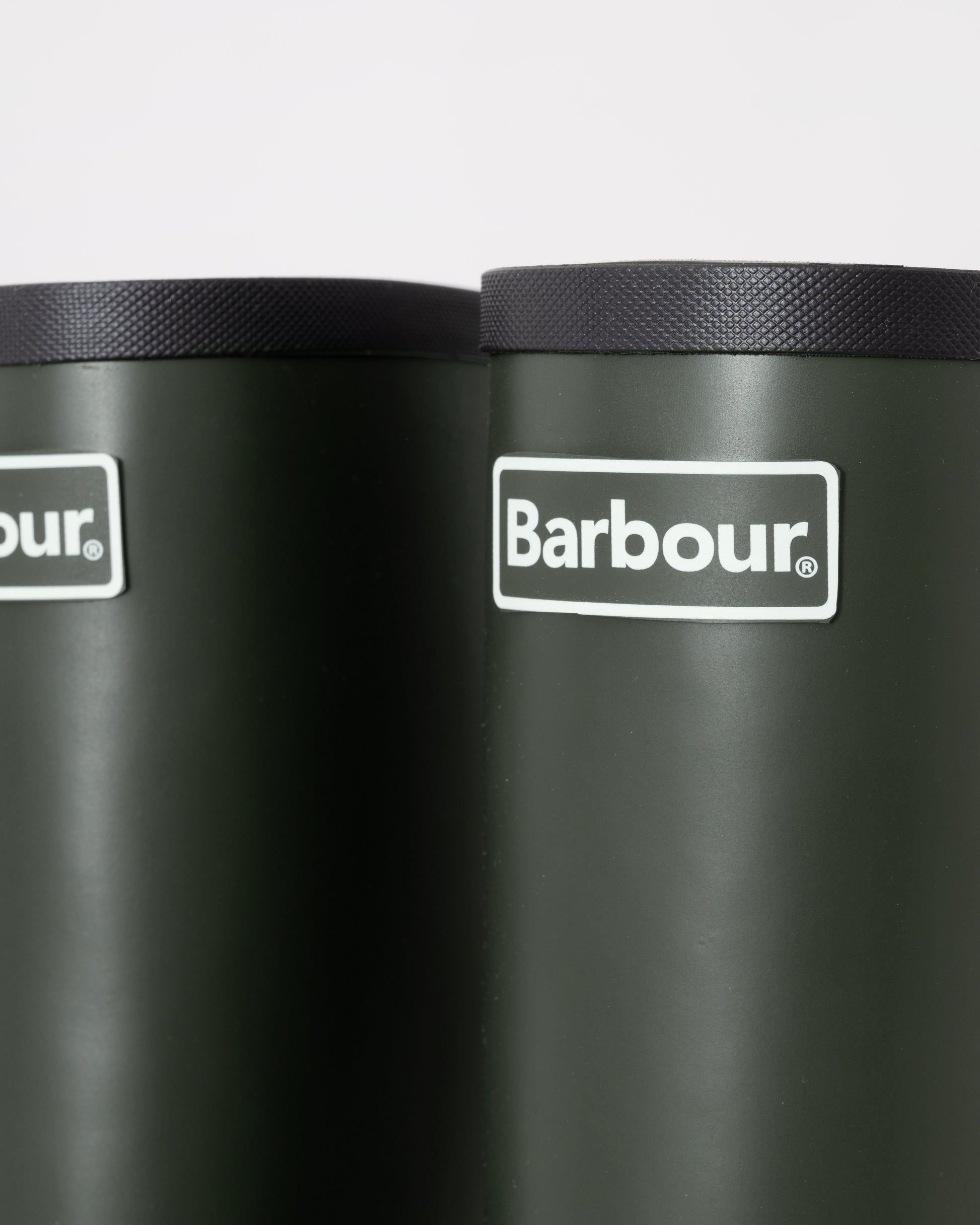 Black Barbour boots with brand logo on a white background