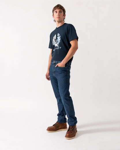 model wearing a pair of Belstaff B69 Mens Regular Fit Mid-Rise Jeans in Washed Indigo