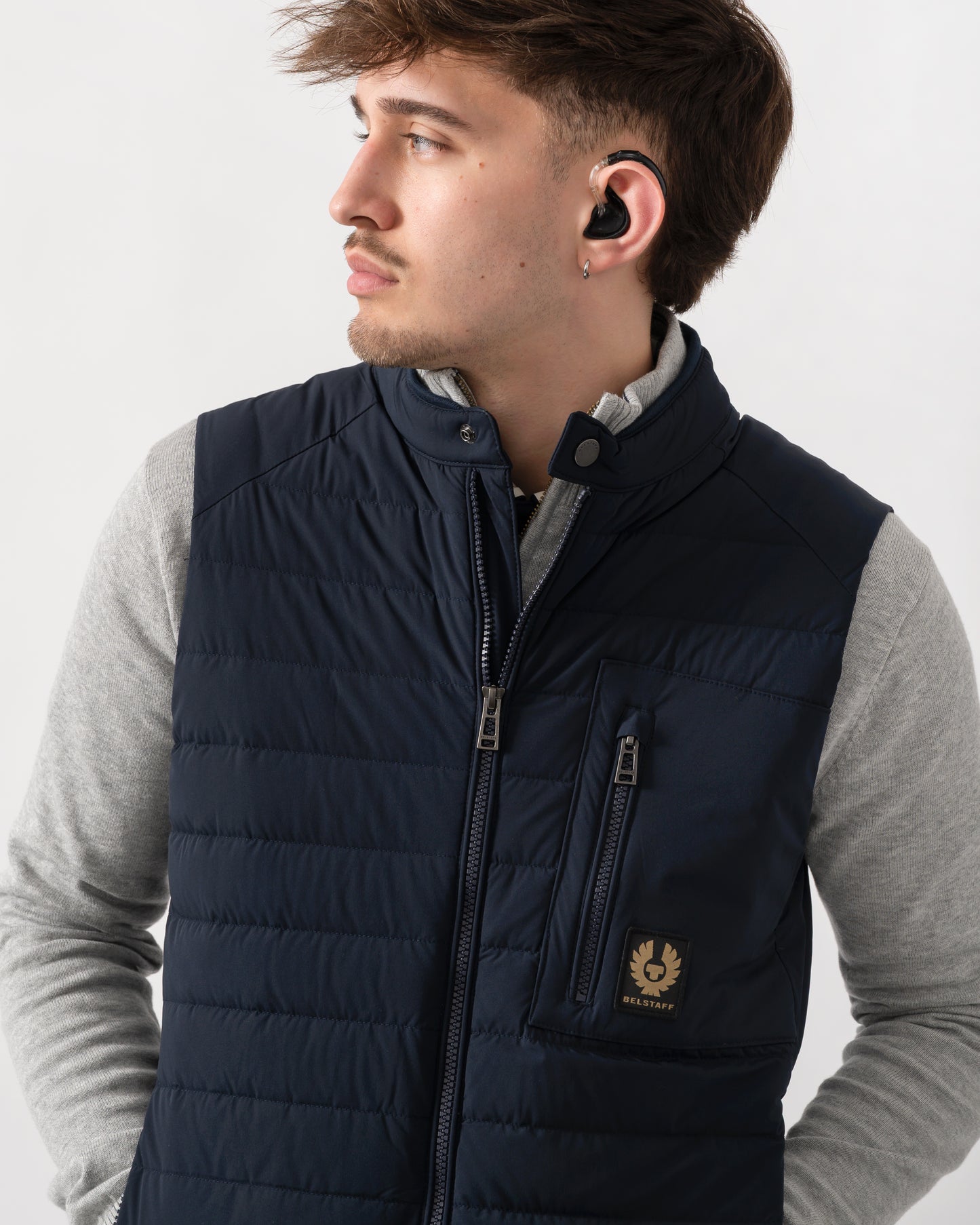 close up shot of a model wearing a Belstaff Chassis Mens Gilet in Dark Ink