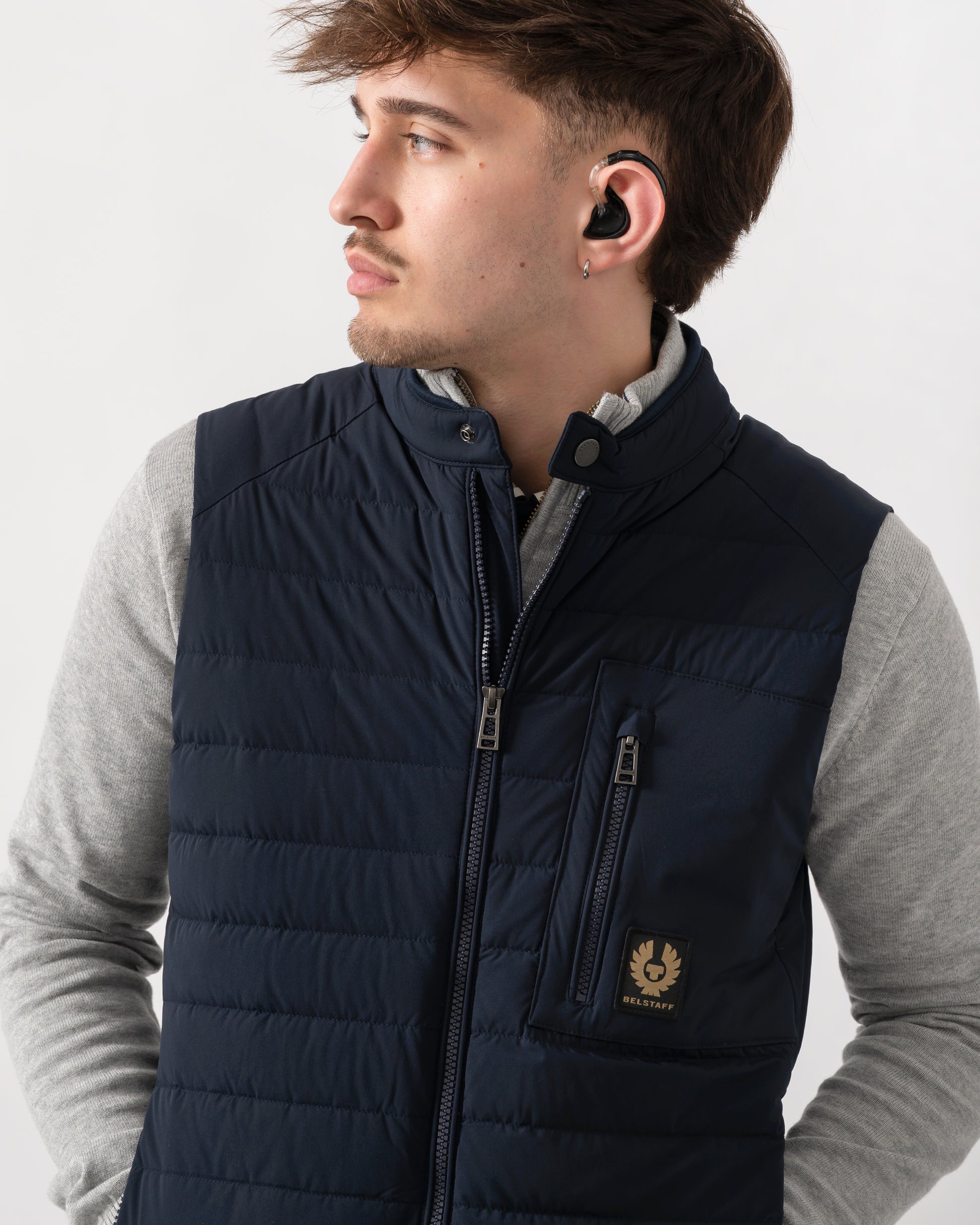 close up shot of a model wearing a Belstaff Chassis Mens Gilet in Dark Ink