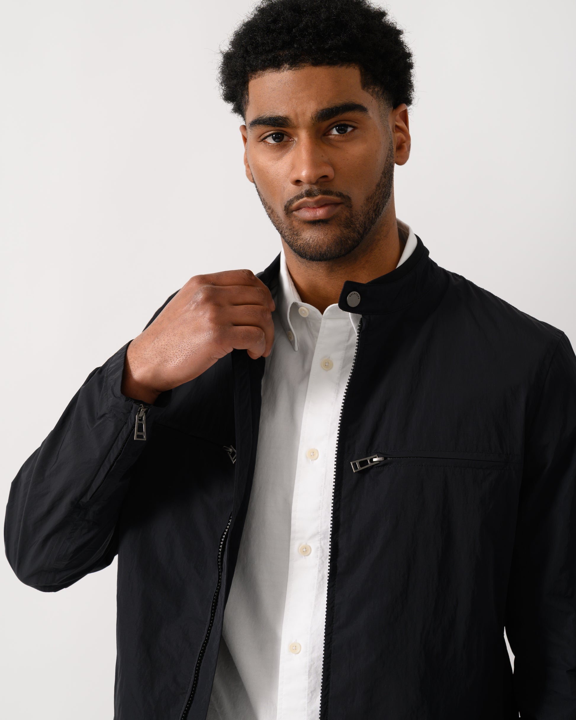 detail shot of a model wearing a Belstaff Grid Mens Jacket in Black