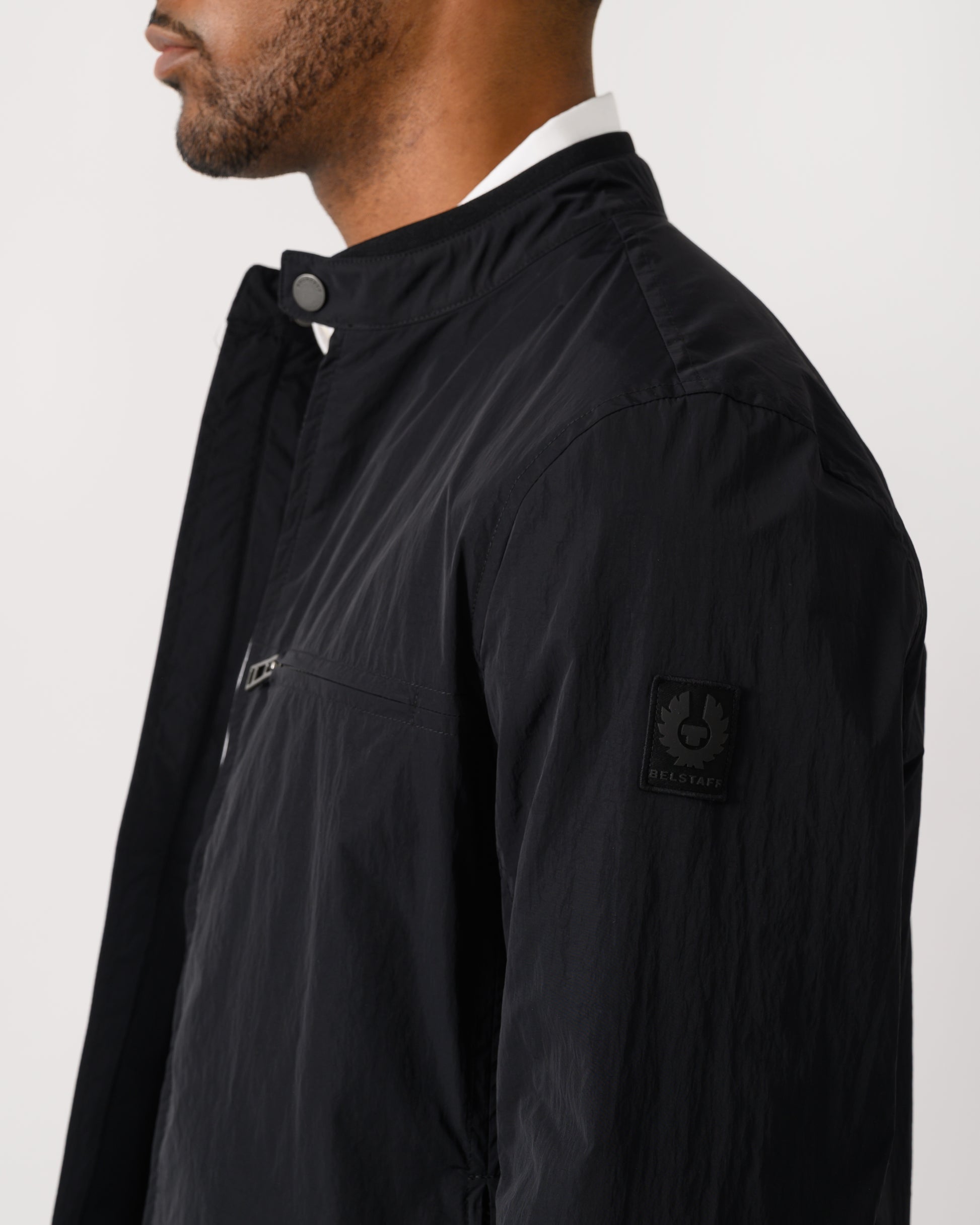 logo detail shot of a Belstaff Grid Mens Jacket in Black