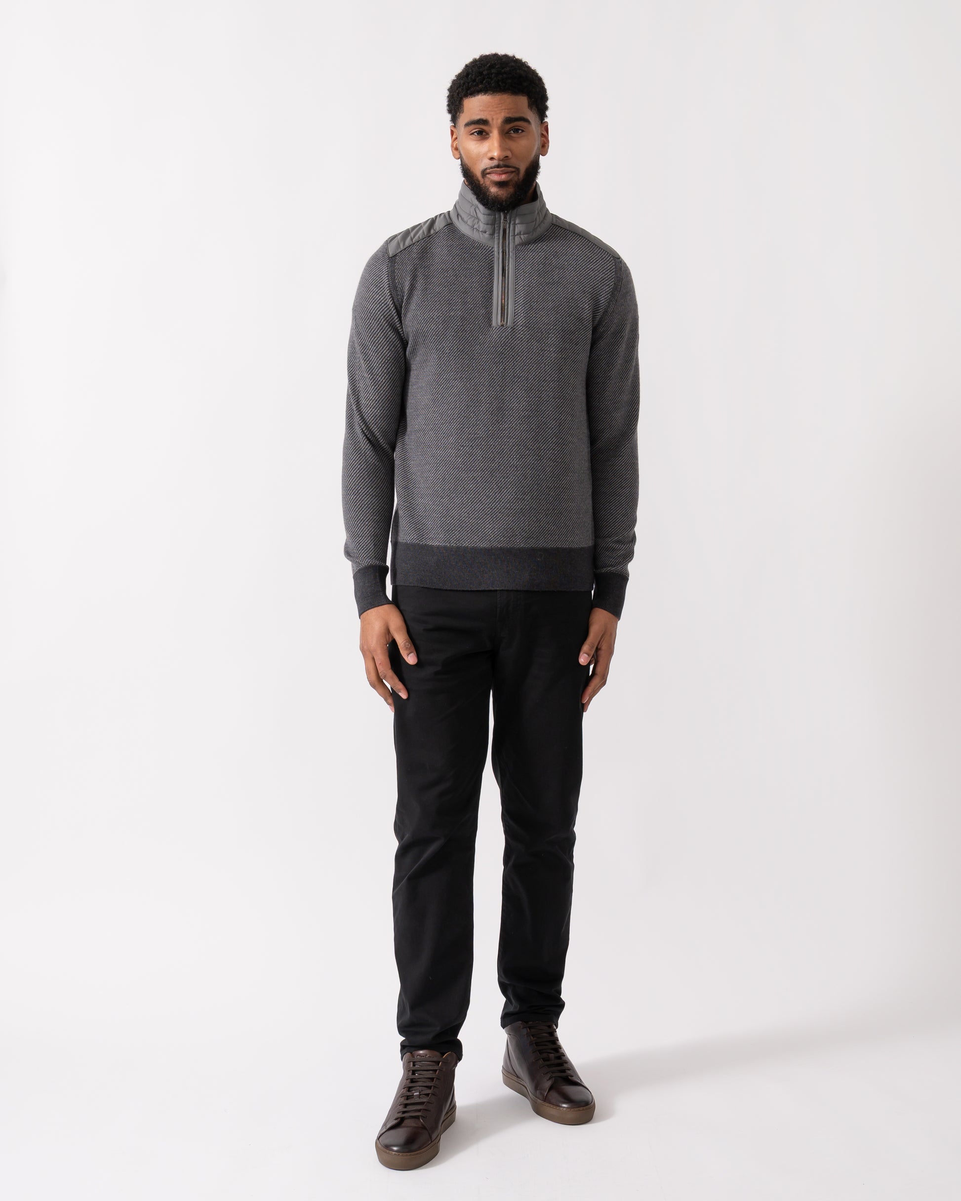 full length of a model wearing a Belstaff Kilmington Mens Quarter Zip Funnel Neck Jumper in Charcoal-Mid Grey