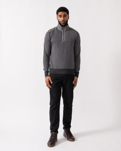 full length of a model wearing a Belstaff Kilmington Mens Quarter Zip Funnel Neck Jumper in Charcoal-Mid Grey