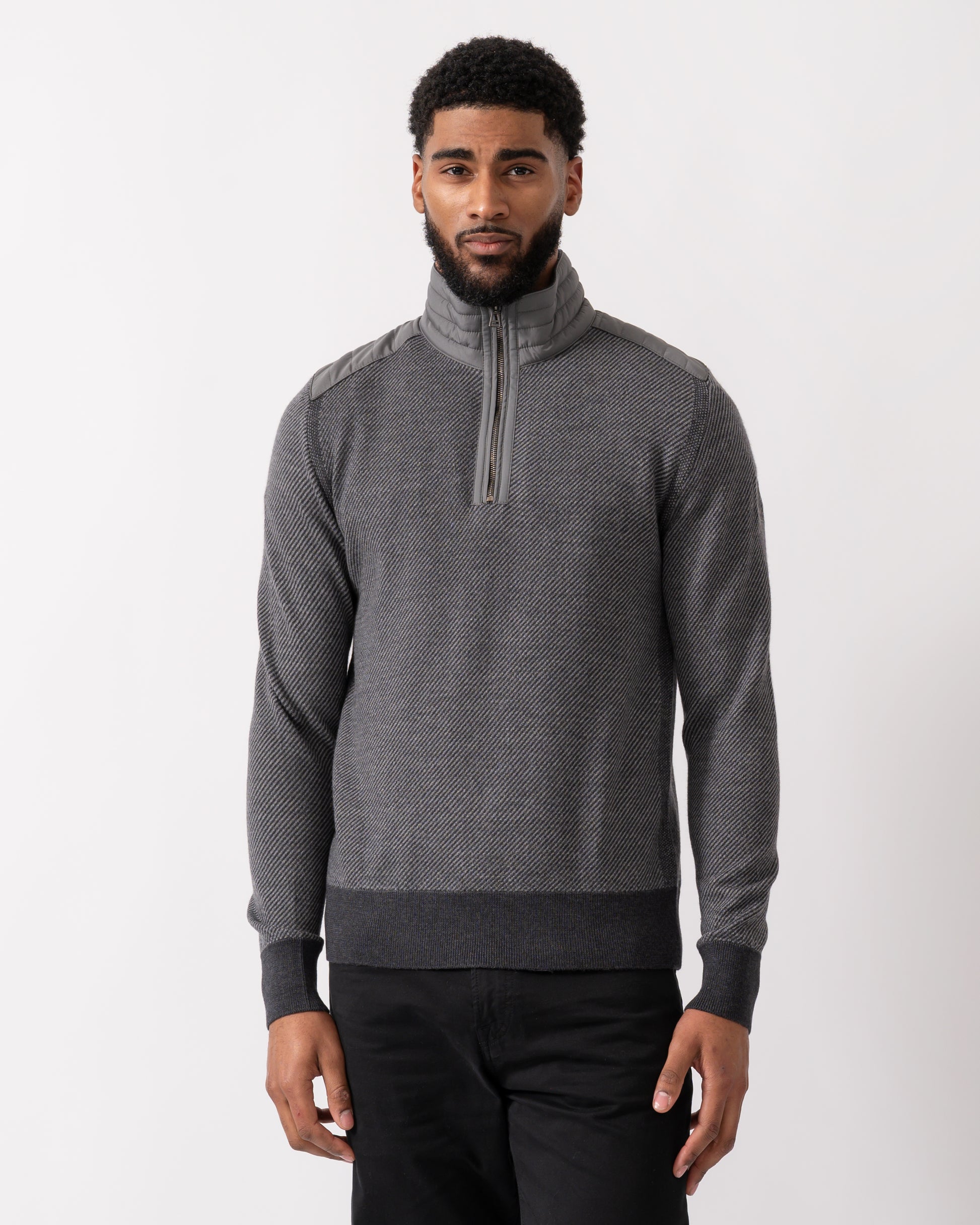 model wearing a Belstaff Kilmington Mens Quarter Zip Funnel Neck Jumper in Charcoal-Mid Grey