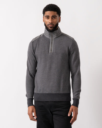 model wearing a Belstaff Kilmington Mens Quarter Zip Funnel Neck Jumper in Charcoal-Mid Grey