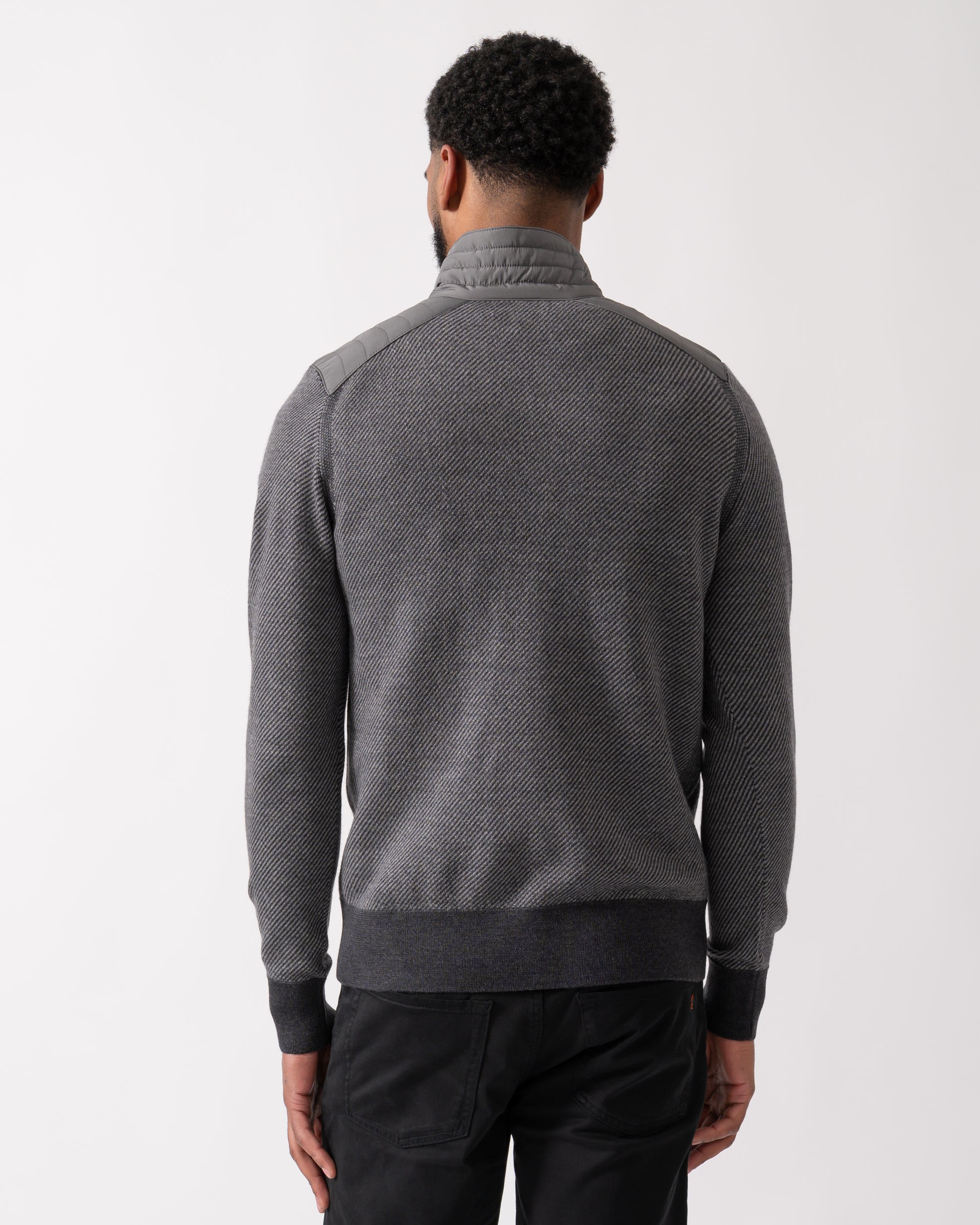 back shot of a model wearing a Belstaff Kilmington Mens Quarter Zip Funnel Neck Jumper in Charcoal-Mid Grey