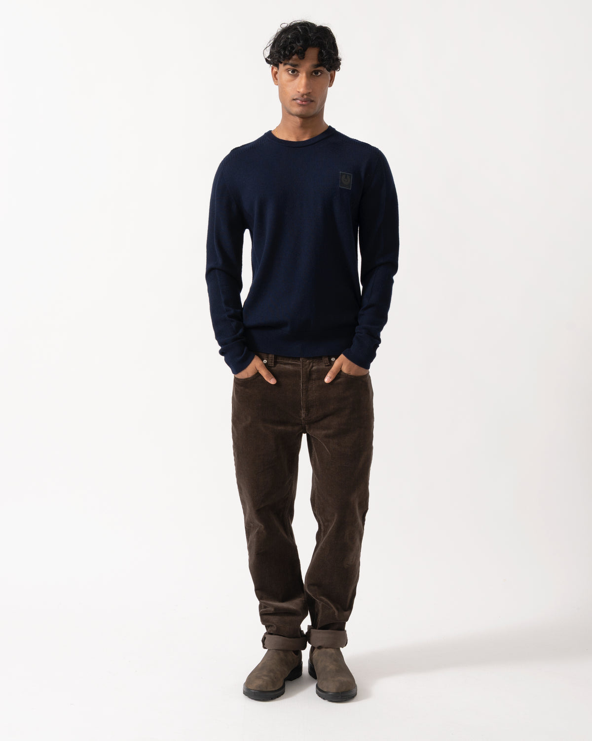 full length Studio photograph of a model wearing a Belstaff Mens Colden Merino Crew Neck Jumper in Dark Ink
