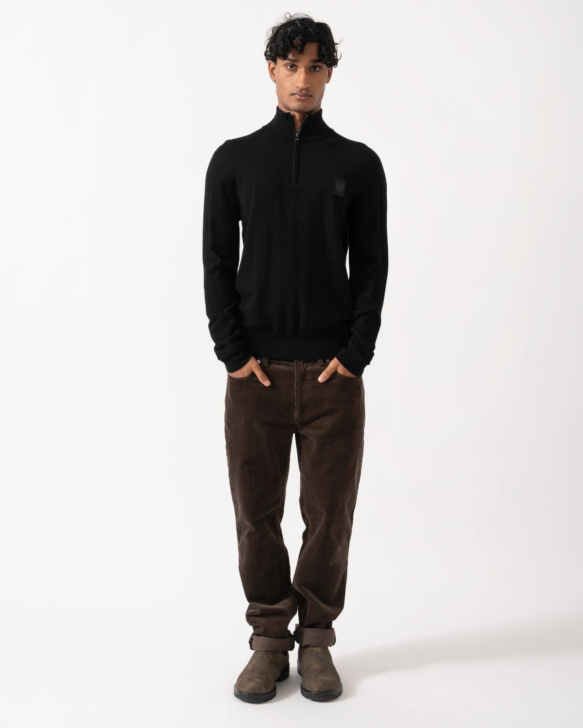 full length Studio photograph of a model wearing a Belstaff Mens Colden Merino Quarter Zip Jumper in Black