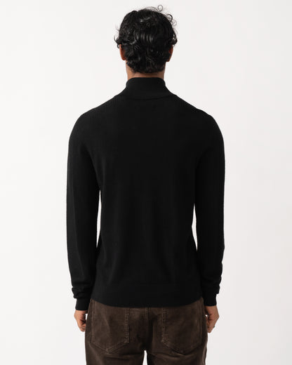 Studio photograph showing the back of a model wearing a Belstaff Mens Colden Merino Quarter Zip Jumper in Black