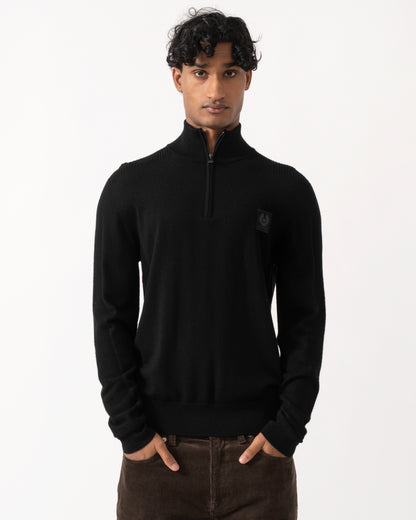 Studio photograph of a model wearing a Belstaff Mens Colden Merino Quarter Zip Jumper in Black