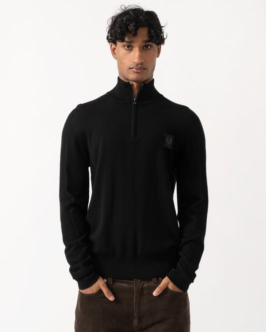 Studio photograph of a model wearing a Belstaff Mens Colden Merino Quarter Zip Jumper in Black