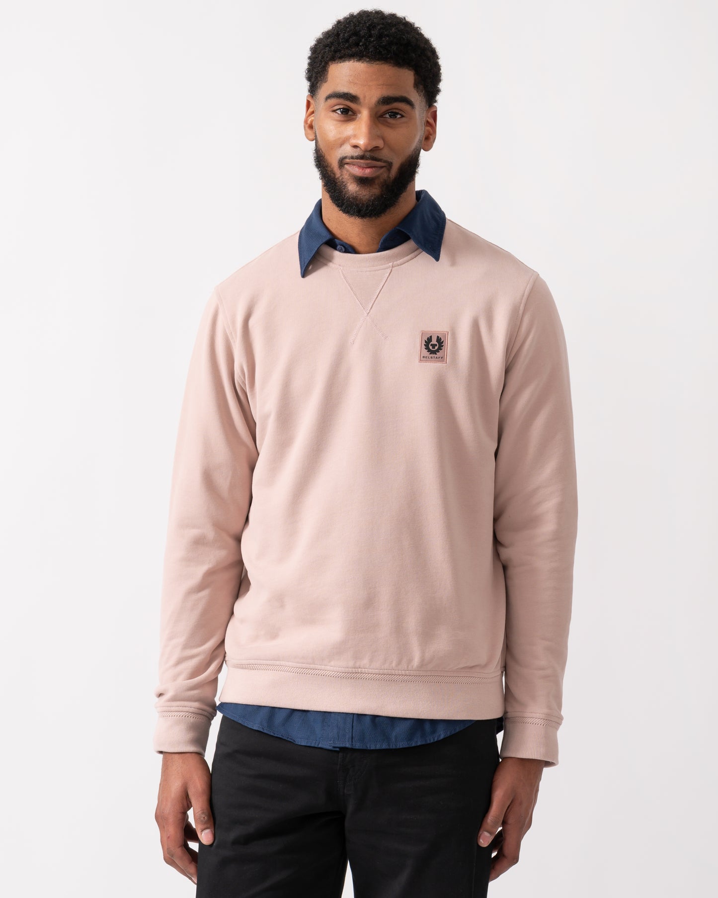 model wearing a Belstaff Mens Crew Neck Sweatshirt With Logo Patch in Dusk Pink