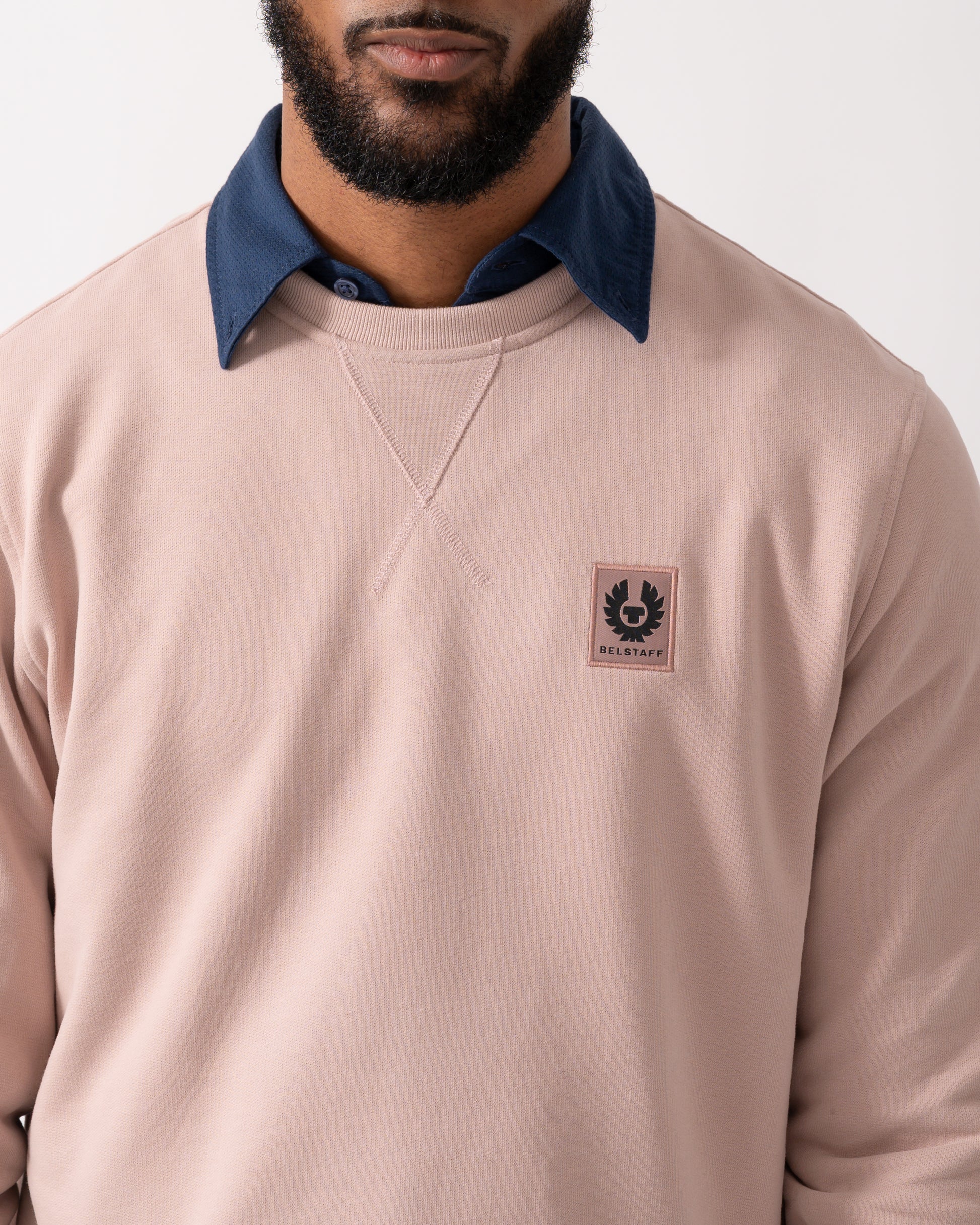 detail of a Belstaff Mens Crew Neck Sweatshirt With Logo Patch in Dusk Pink