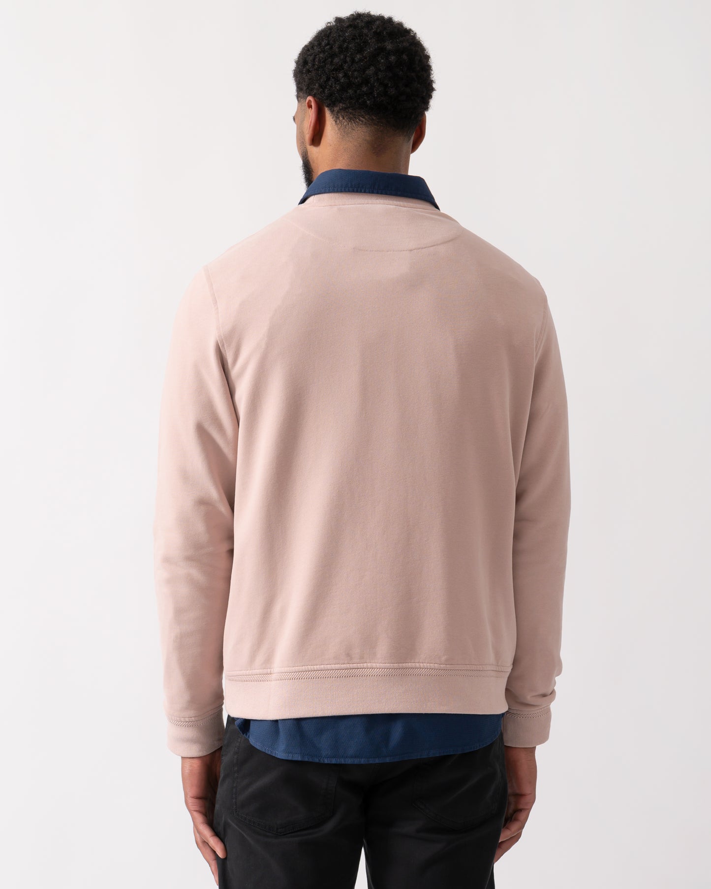 back shot of a model wearing a Belstaff Mens Crew Neck Sweatshirt With Logo Patch in Dusk Pink