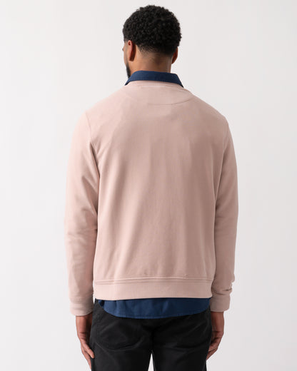 back shot of a model wearing a Belstaff Mens Crew Neck Sweatshirt With Logo Patch in Dusk Pink