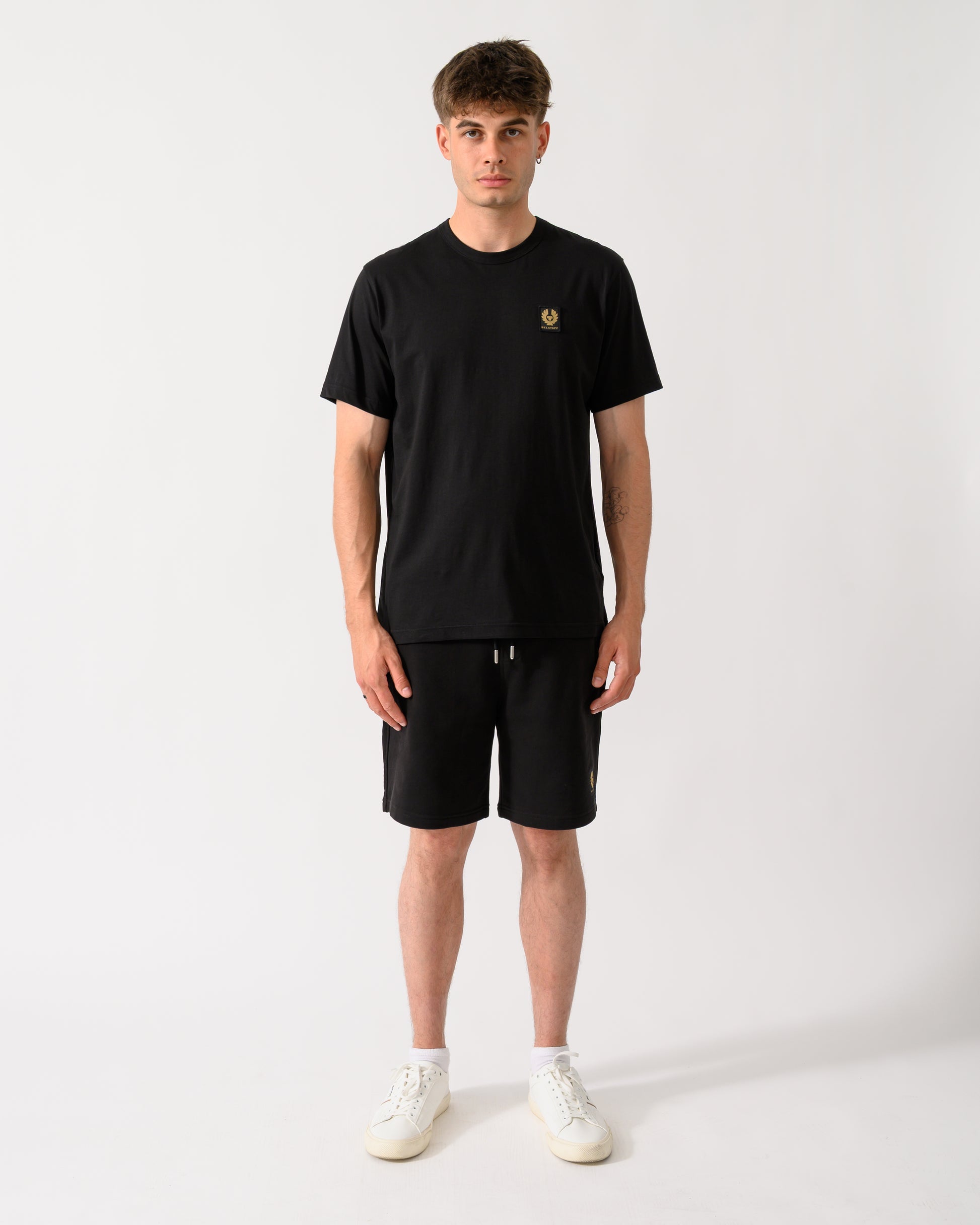 full length shot of a model wearing a Belstaff Mens Icon Logo T-Shirt in Black