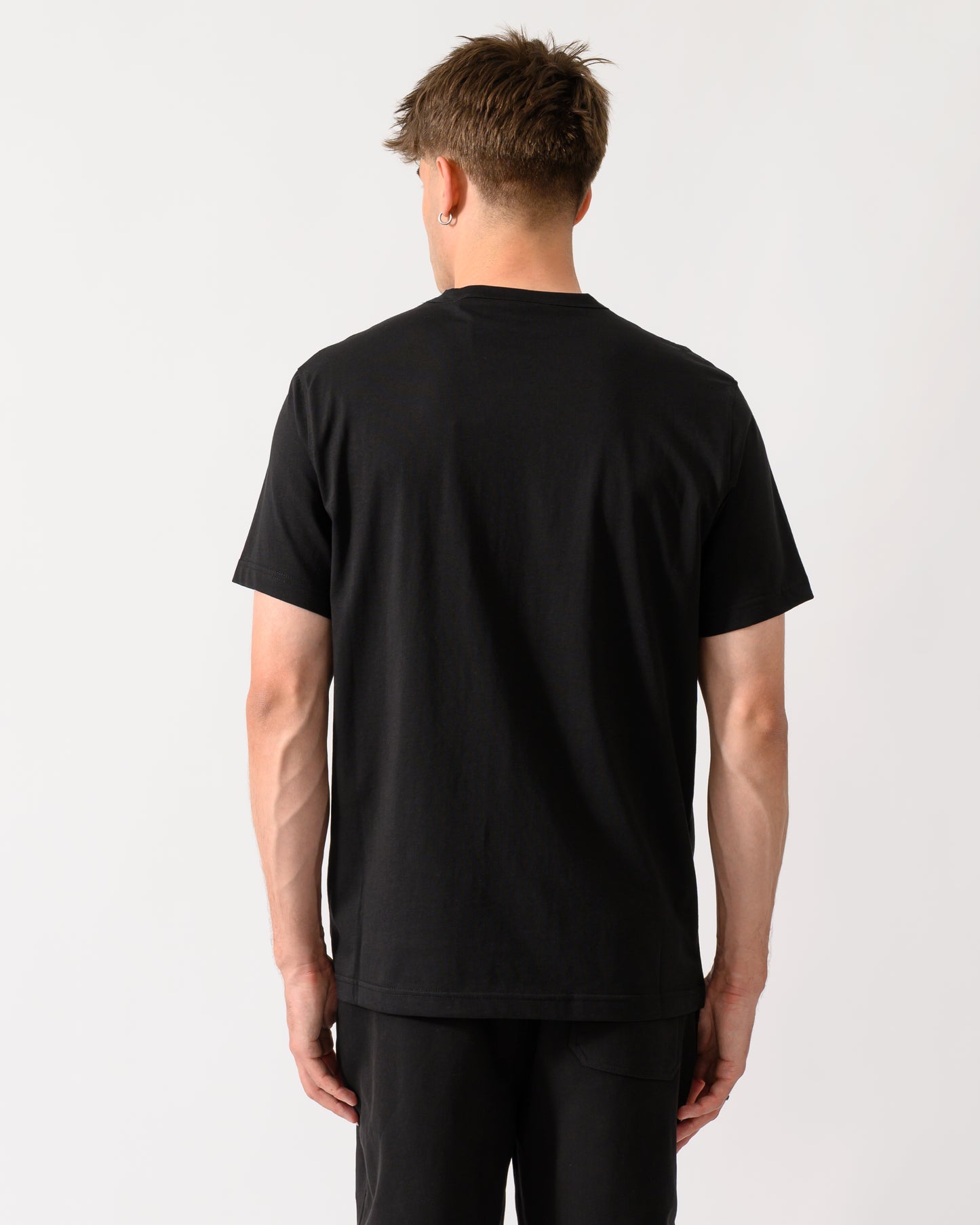 back shot of a model wearing a Belstaff Mens Icon Logo T-Shirt in Black