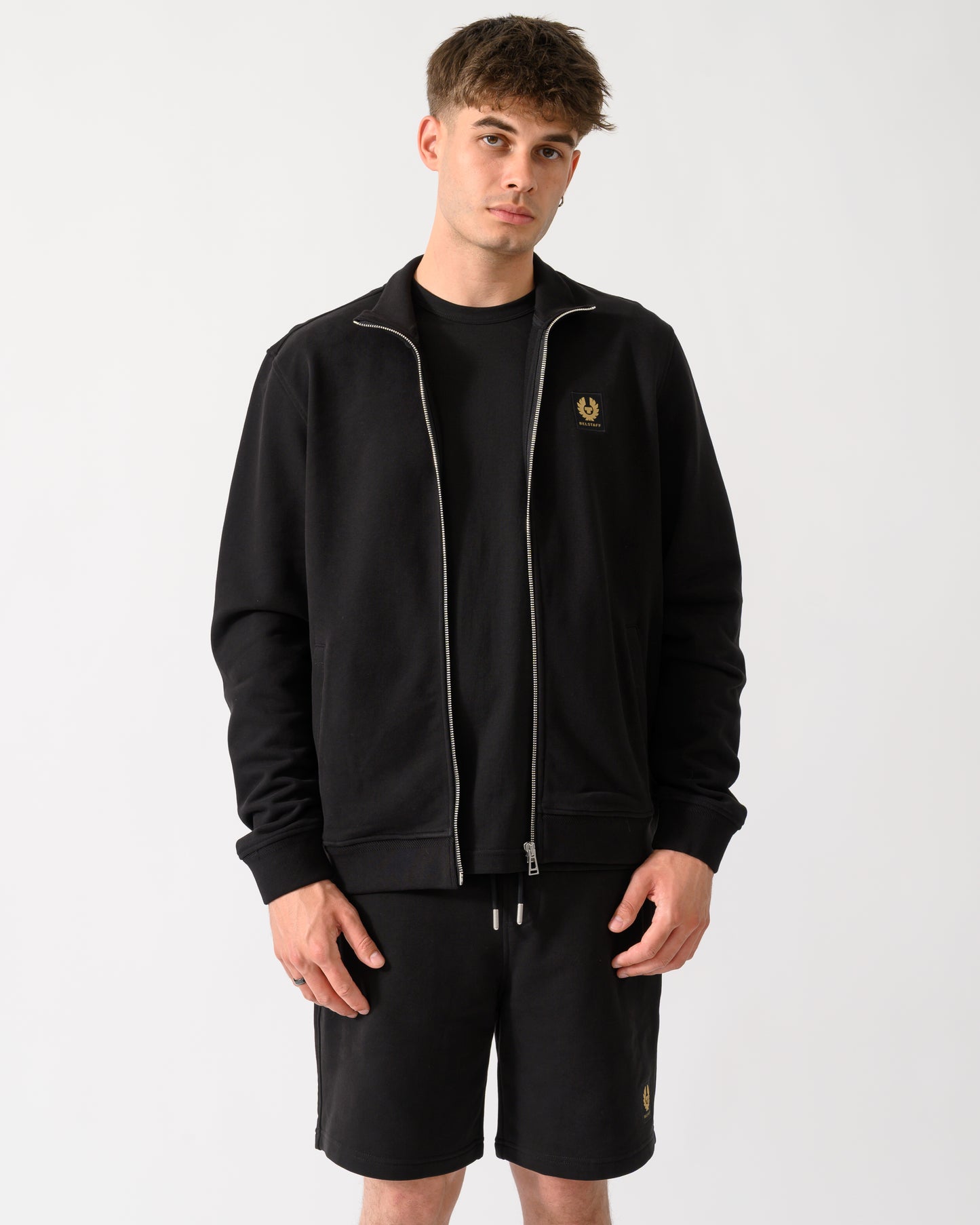 model wearing a Belstaff Mens Logo Full Zip Sweatshirt in Black