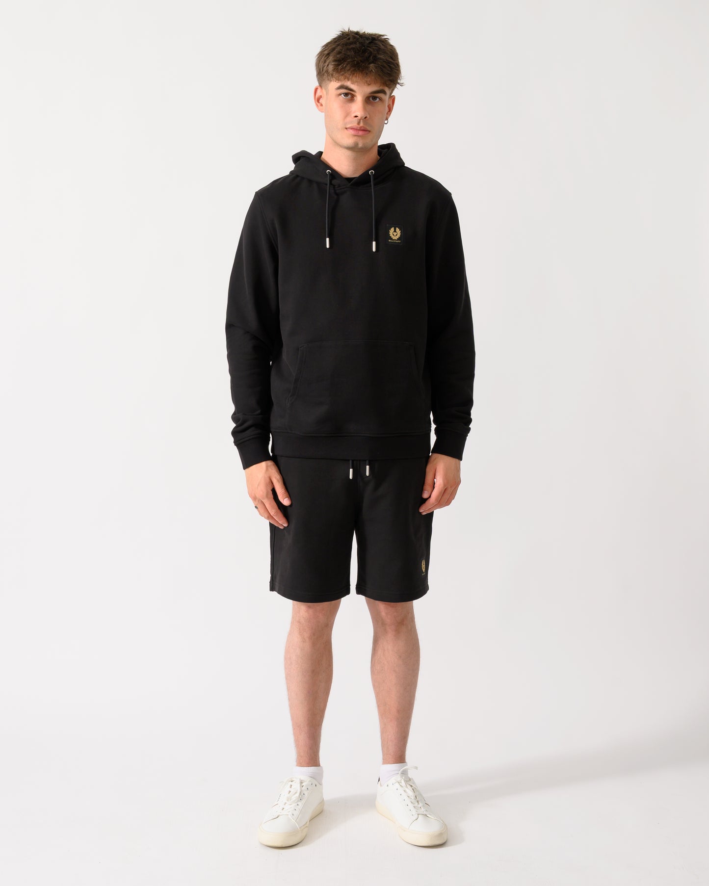 full length shot of a model wearing a Belstaff Mens Logo Hoodie in Black