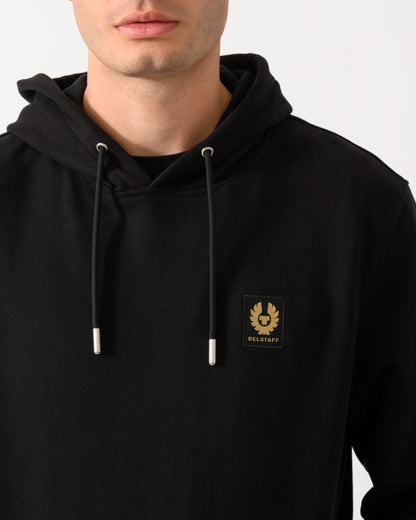 close up shot of a model wearing a Belstaff Mens Logo Hoodie in Black