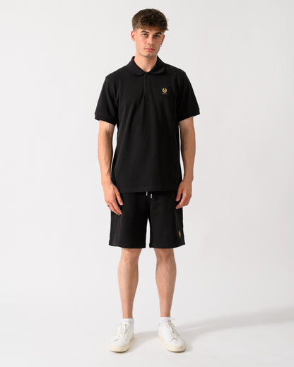 full length shot of a model wearing a Belstaff Mens Logo Polo in Black