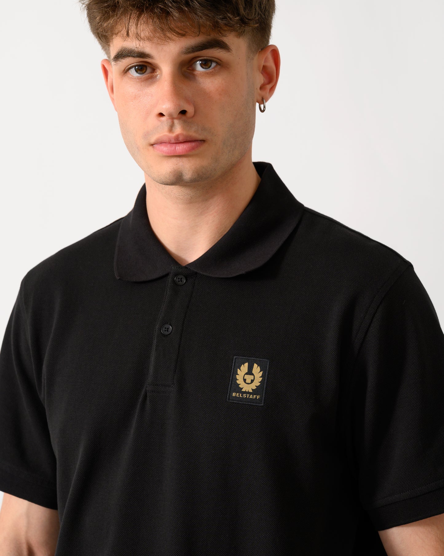 close up shot of a model wearing a Belstaff Mens Logo Polo in Black