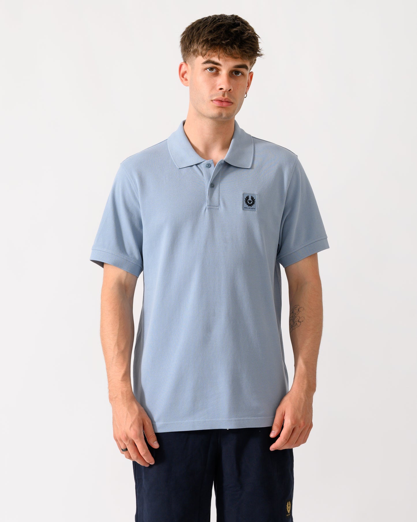 model wearing a Belstaff Mens Logo Polo in Mist Blue