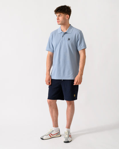 full length of a model wearing a Belstaff Mens Logo Polo in Mist Blue
