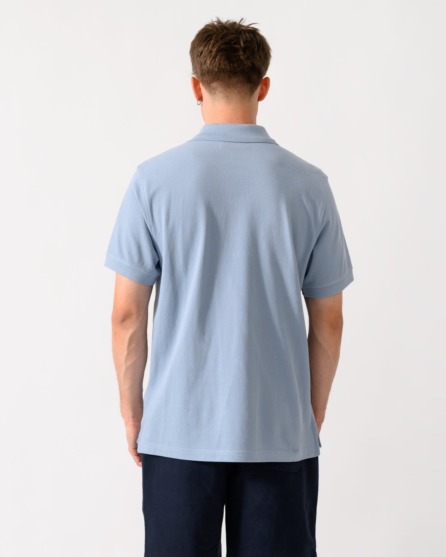 back of a model wearing a Belstaff Mens Logo Polo in Mist Blue