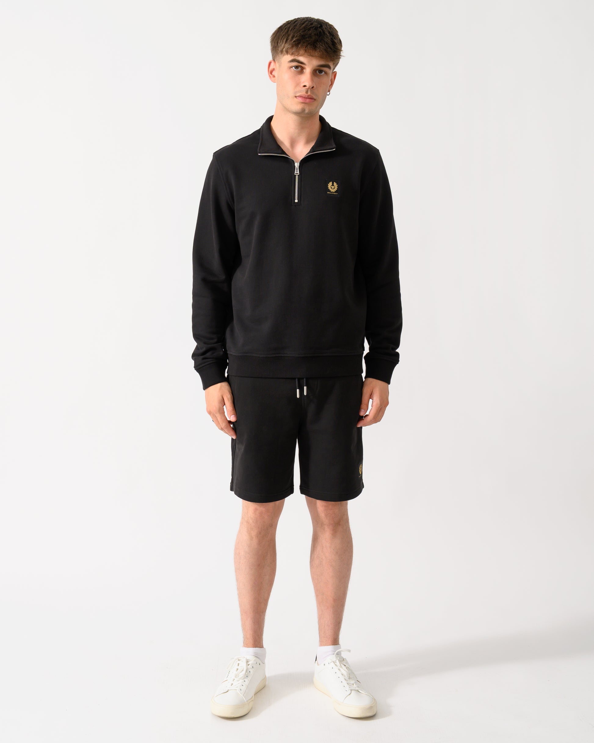 full length shot of a model wearing a Belstaff Mens Logo Quarter Zip Sweatshirt in Black